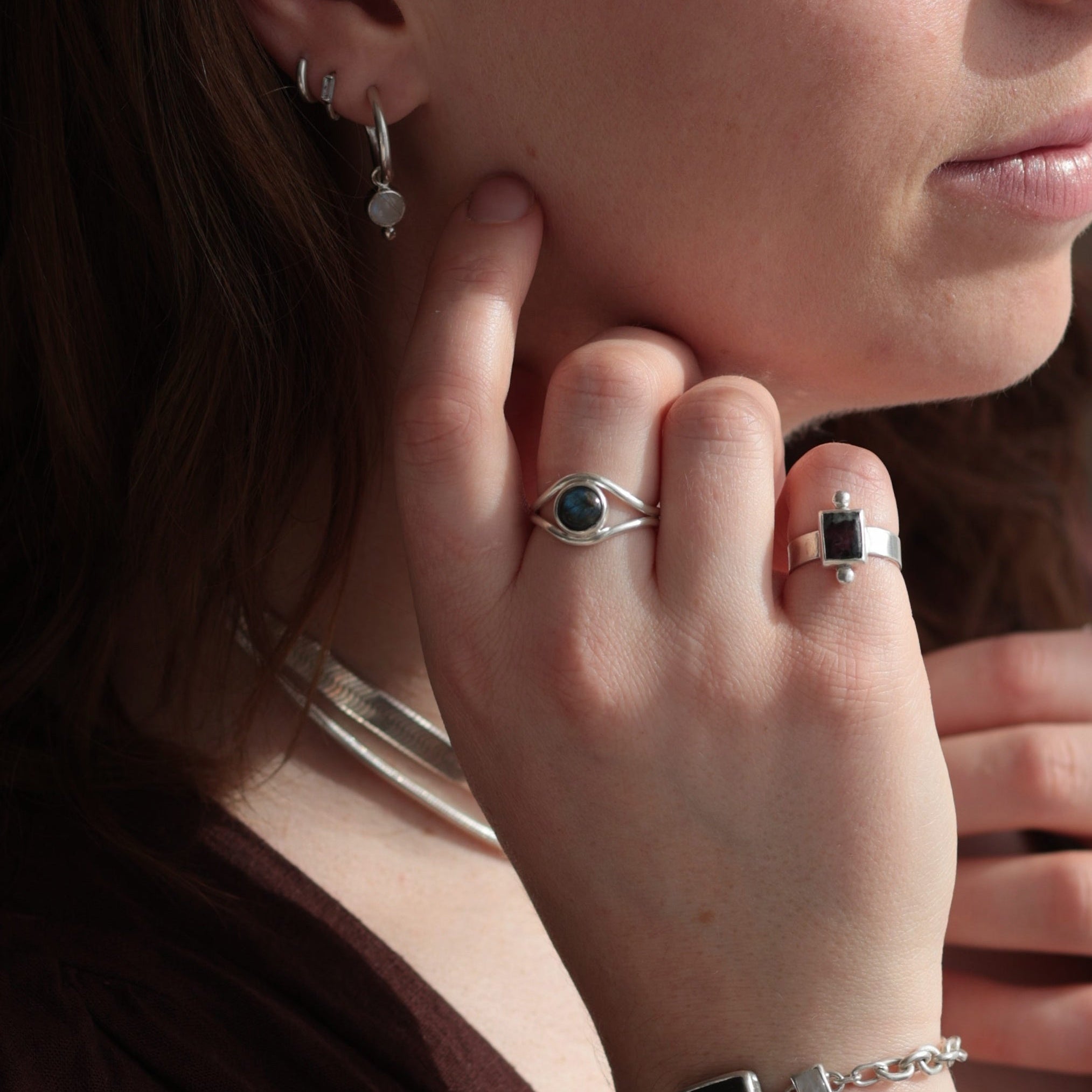 Sterling silver and gemstone rings and earrings close-up