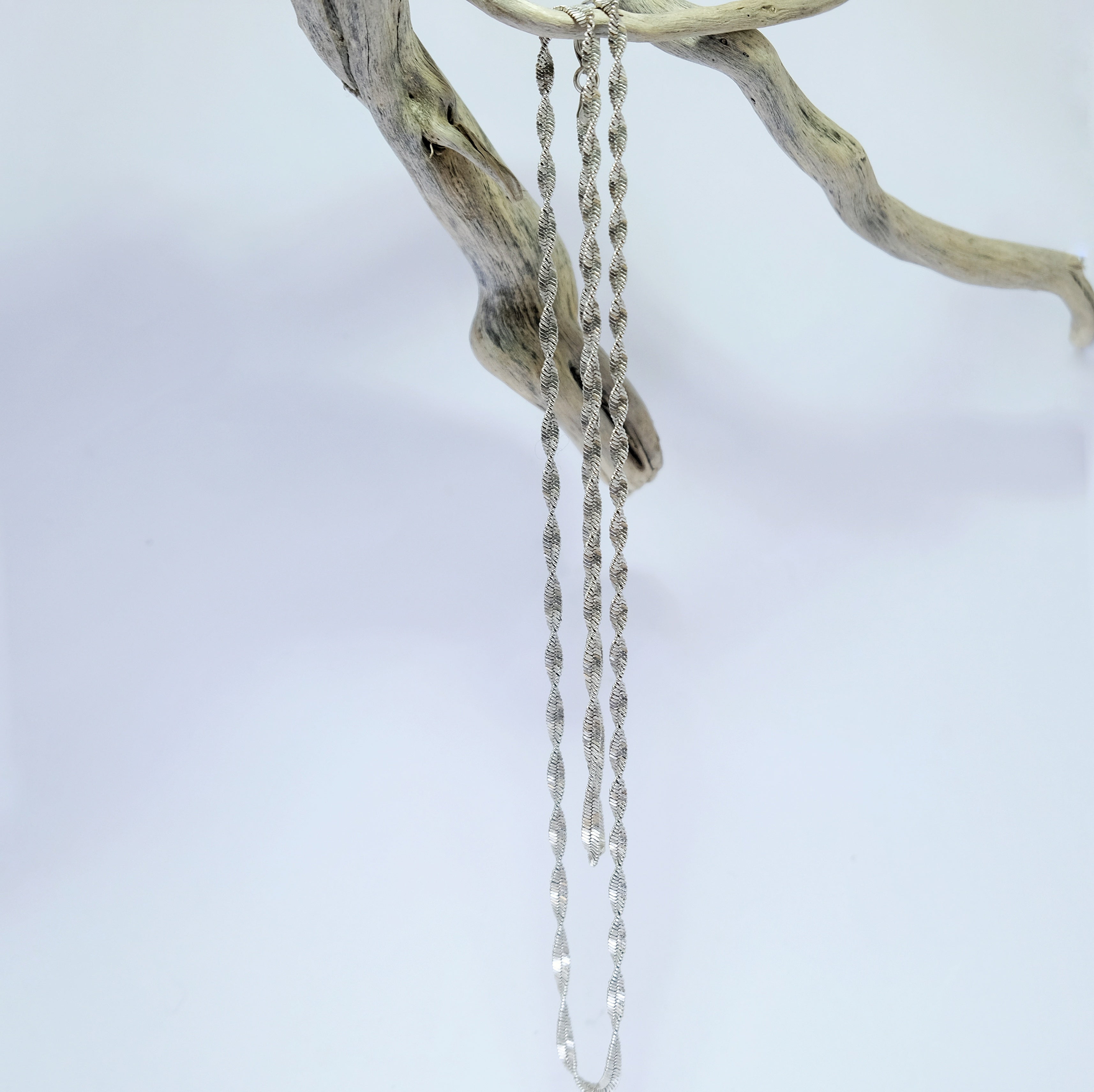 Chunky silver twist chain draped over driftwood | Made with Grace | handmade jewellery nz