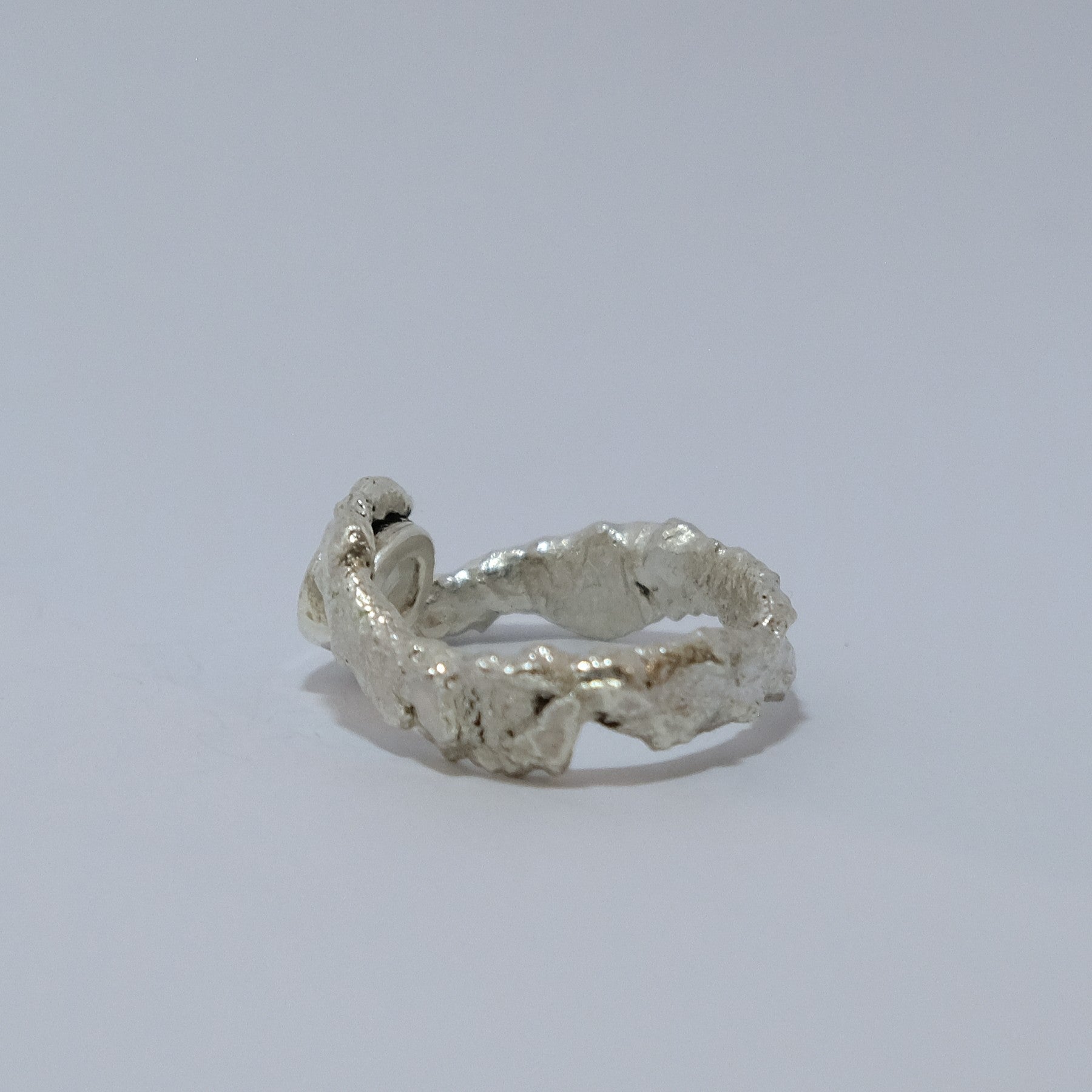 Rainbow moonstone ring, gemstone wrapped in silver, shown from side | Made with Grace | handmade jewellery nz