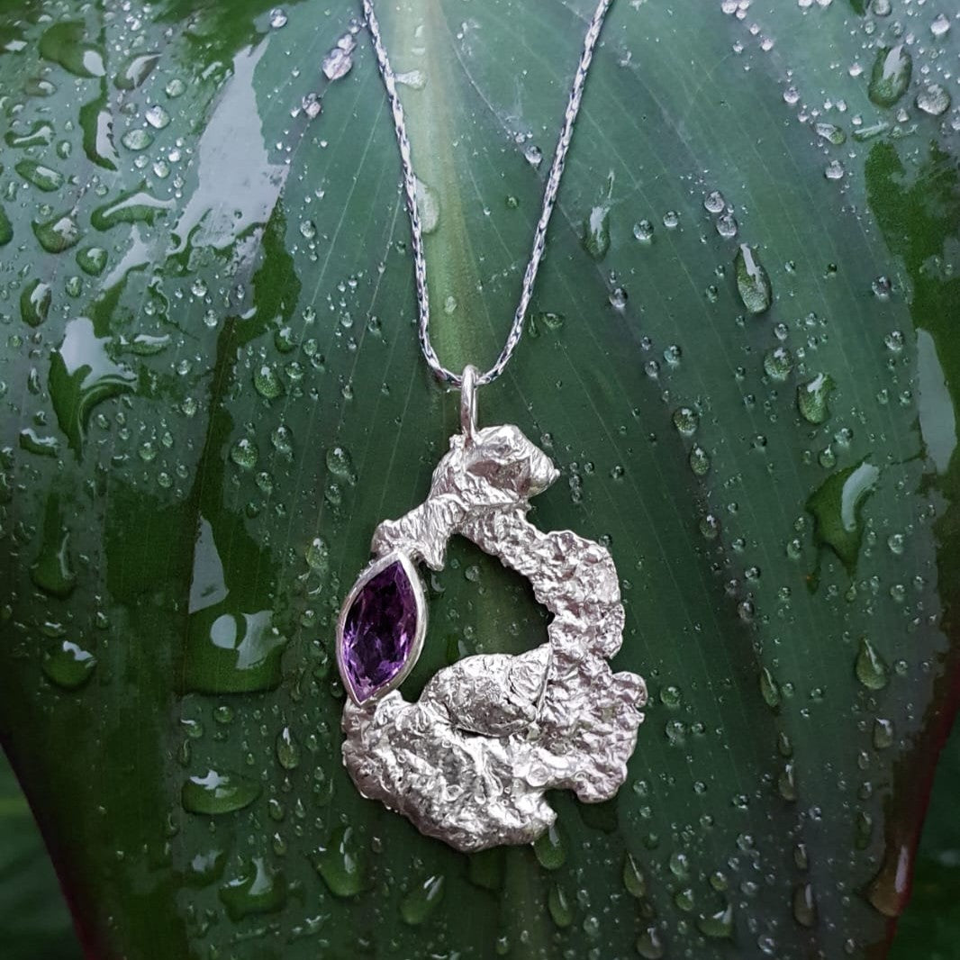 Silver and purple gemstone large pendant, lying on a leaf| Made with Grace | handmade jewellery nz