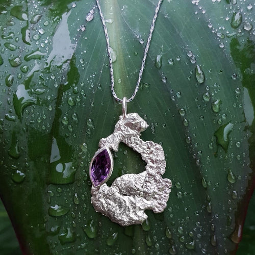 Silver and purple gemstone large pendant, lying on a leaf| Made with Grace | handmade jewellery nz