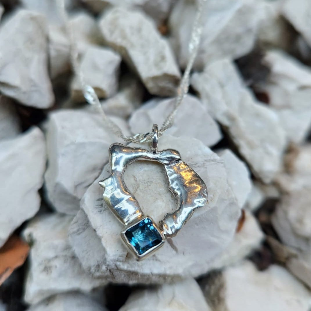 Organic silver ring pendant with bright blue square gemstone on rocks | Made with Grace | handmade jewellery nz