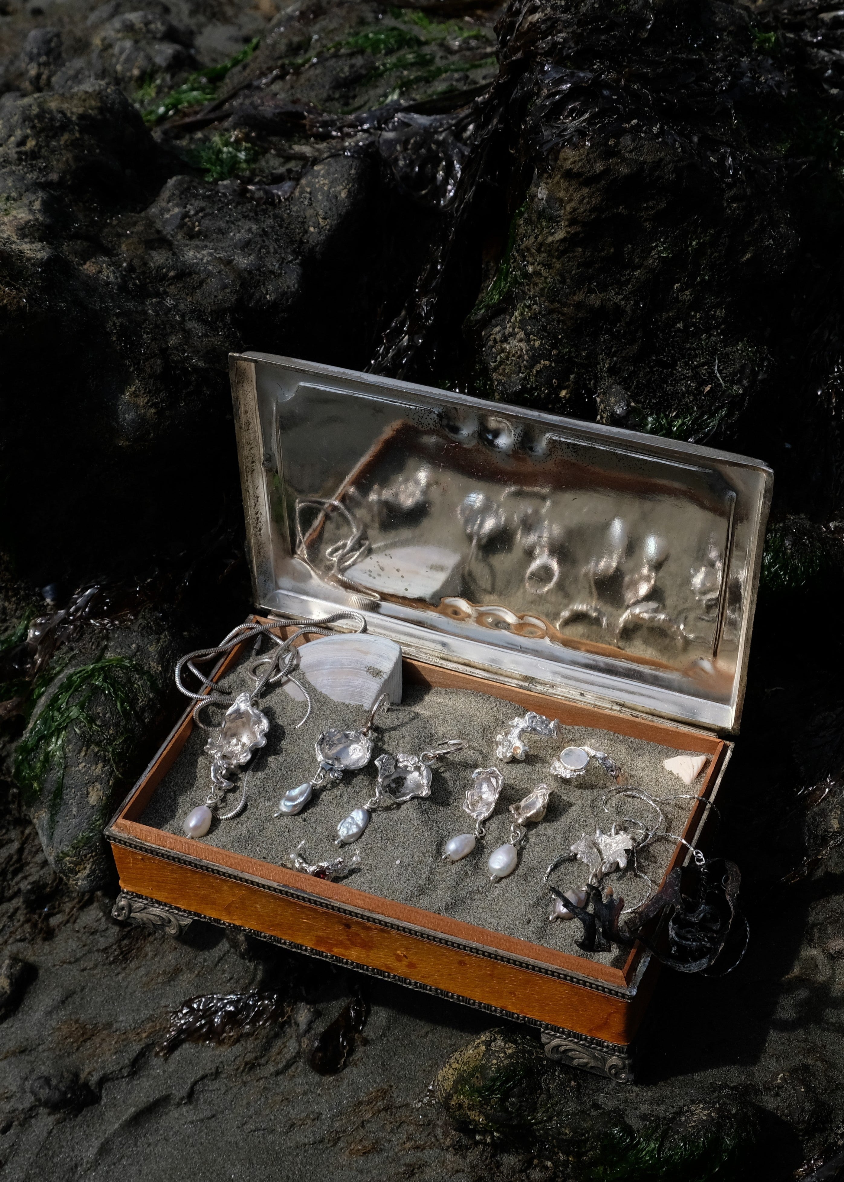 Silver and pearl jewellery in vintage jewellery box by a rockpool | Made with Grace | handmade jewellery nz